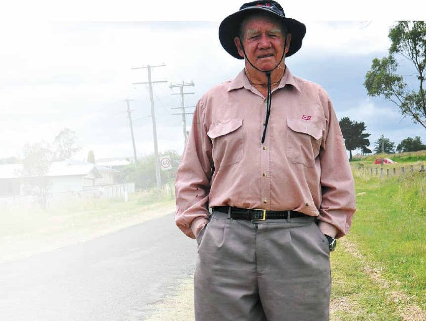 Resident Bob Keogh stands in roadside divot on Warner St, which he said could cause a serious accident. Resident Bob Keogh stands in roadside divot on Warner St, which he said could cause a serious accident.